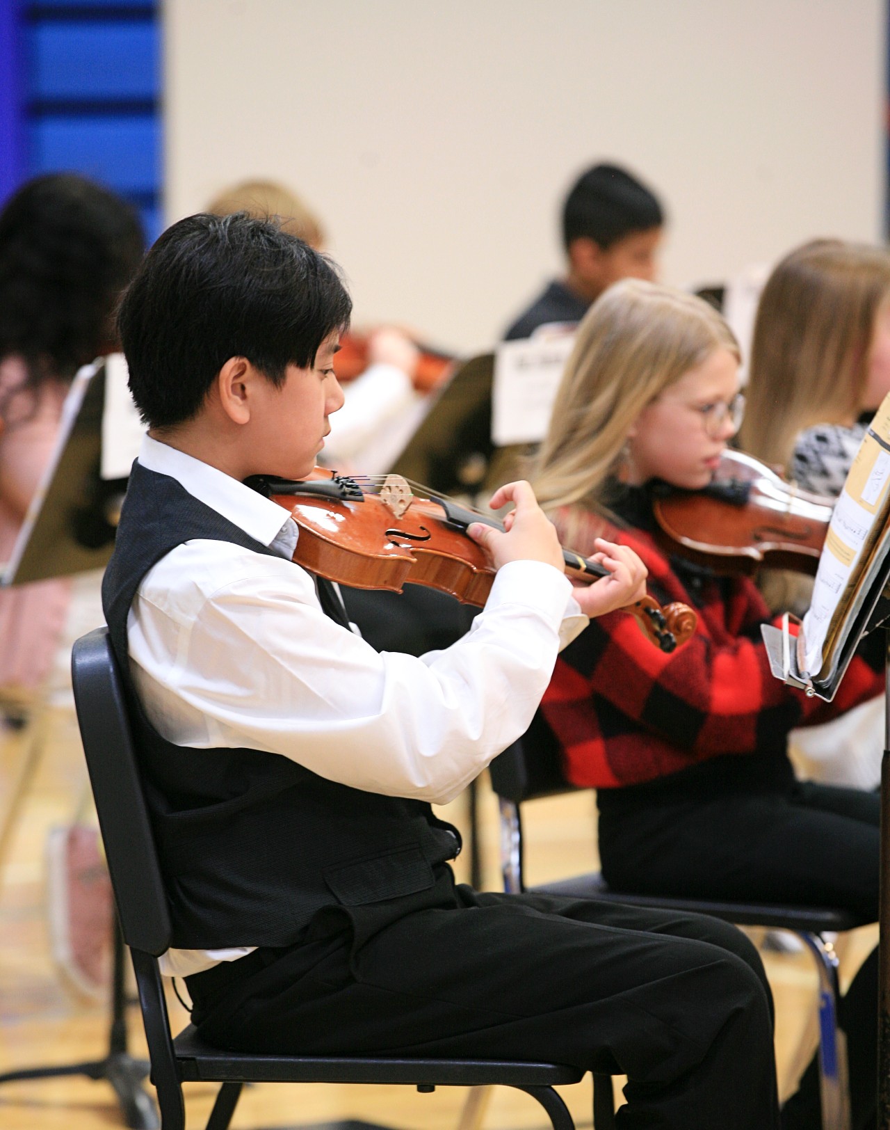 Sartell orchestra students playing violin