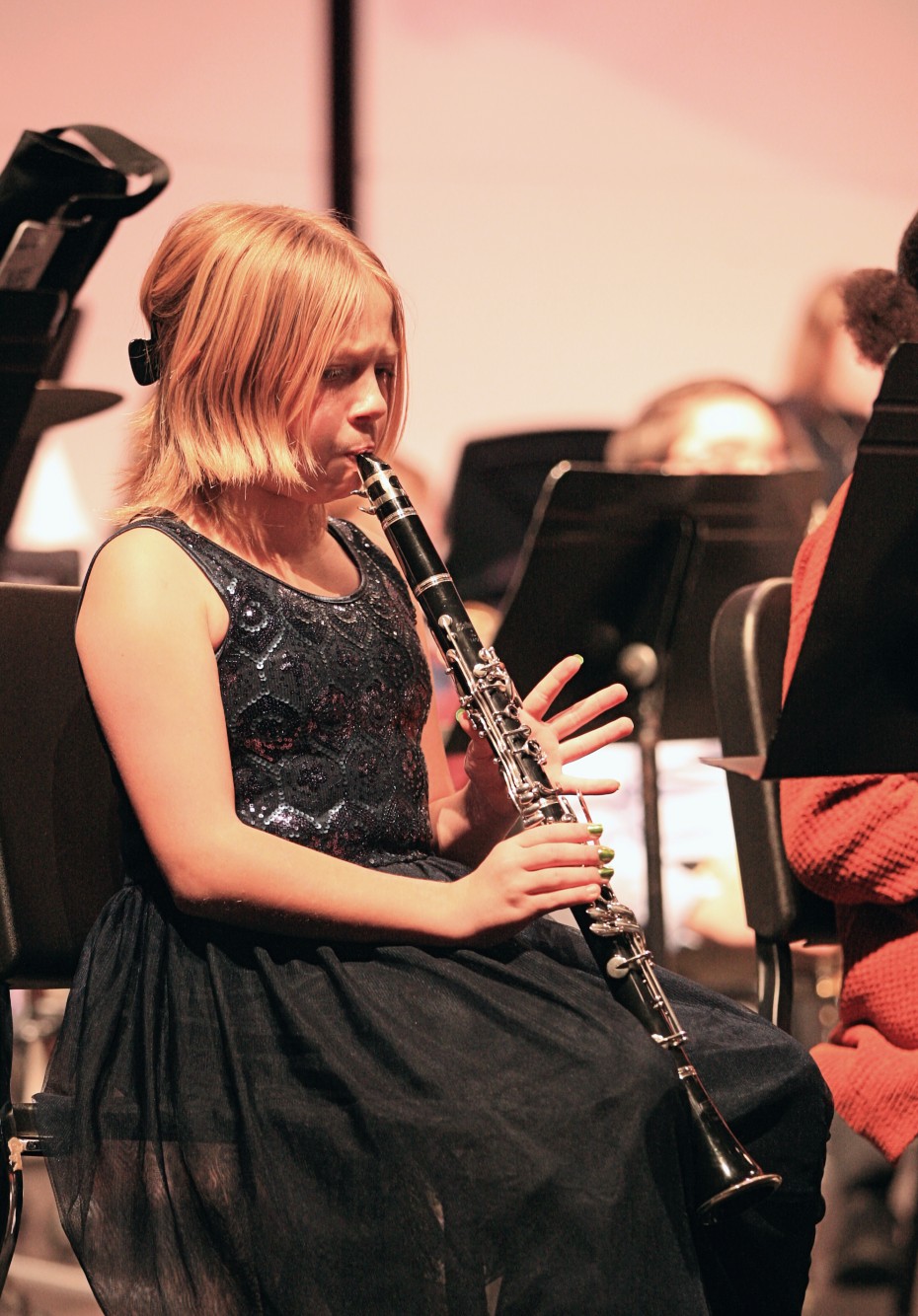 Student playing clarinet during a concert
